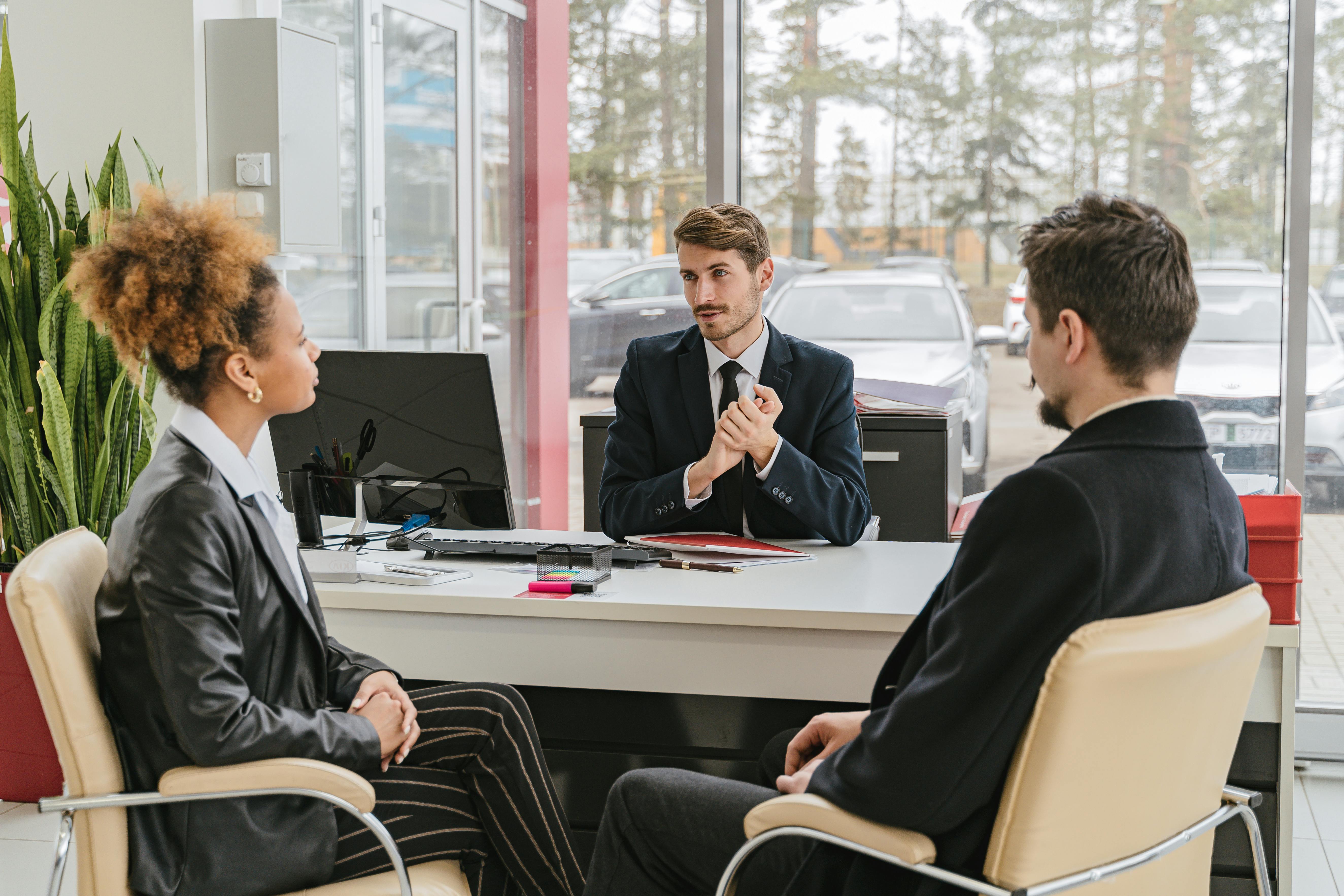 Business professionals collaborating during a meeting in a modern office.