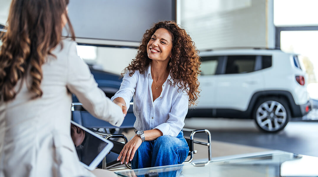 Two people reviewing credit information together.
